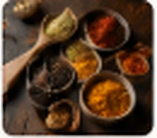 Tadka spices – mustard seeds, chillies and turmeric in small bowls