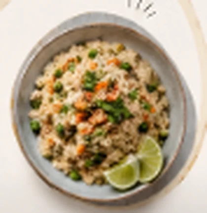 Upma with vegetables and a lemon wedge